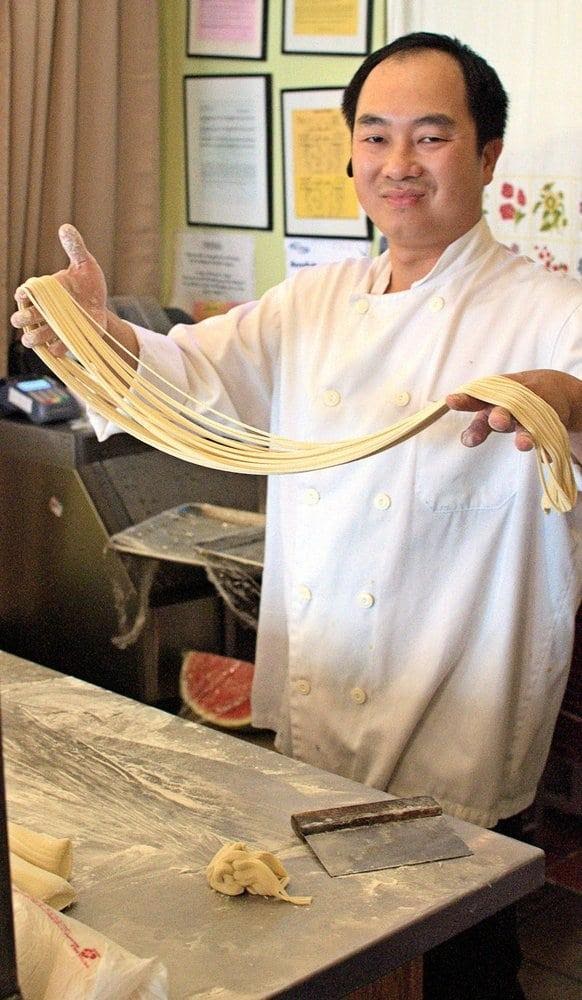 Photo of Ark Chinese Restaurant - Alameda, CA, United States. Chef making hand-pulled noodles
